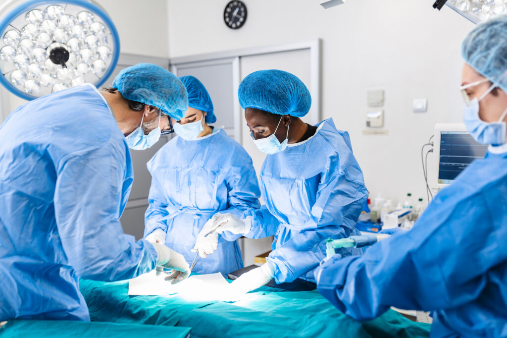 Team of doctors concentrating on a patient during a surgery in hospital